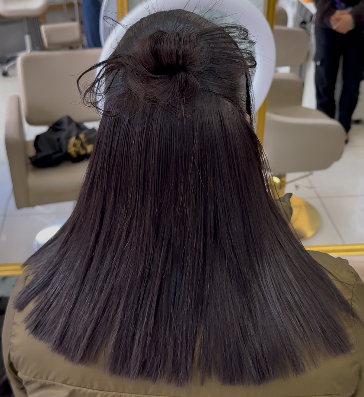 Back view half-up bun straight ends
